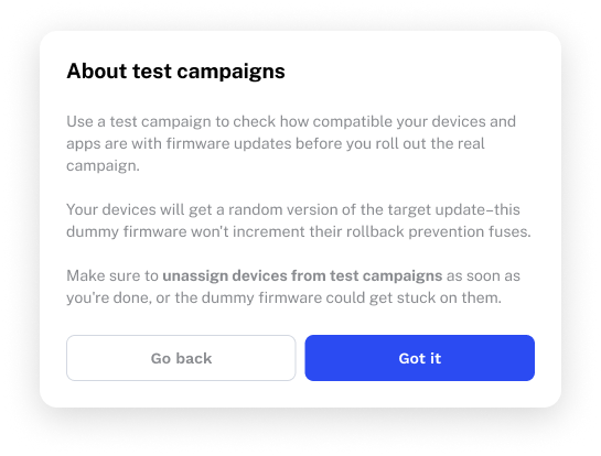 A modal dialog titled 'About test campaigns' with three paragraphs explaining test campaign behavior, dummy firmware, and a bolded warning to 'unassign devices from test campaigns' as soon as testing is complete. Buttons: Go back and Got it.